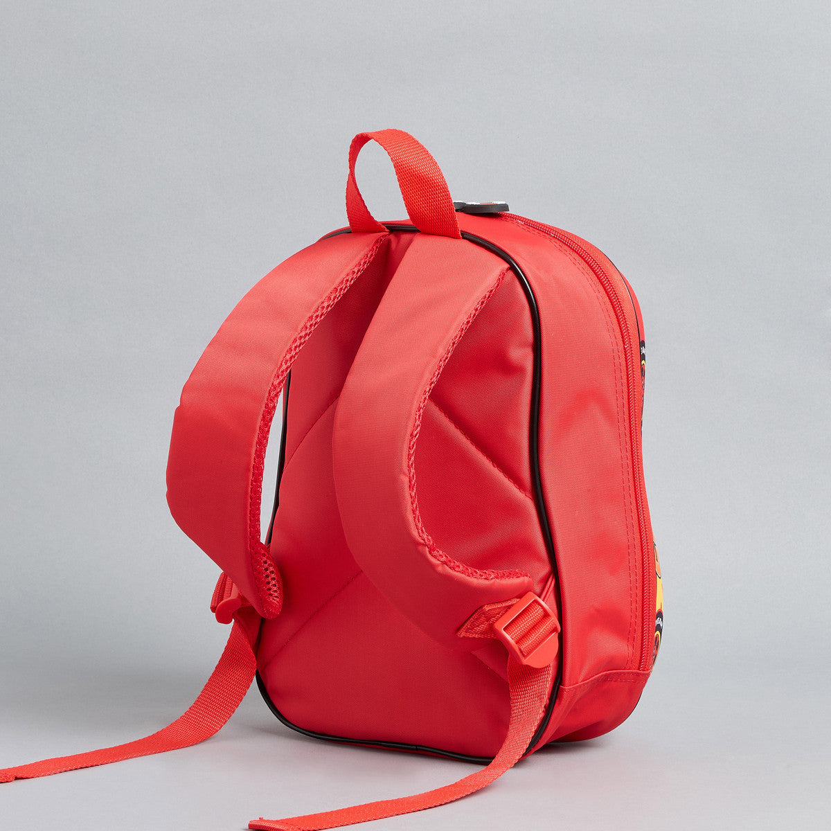 Car print backpack with adjustable shoulder straps and zip closure