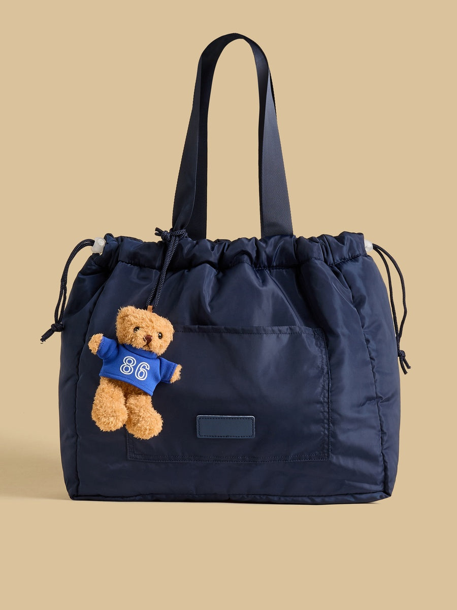 Bear charm shopper bag with drawstring closure