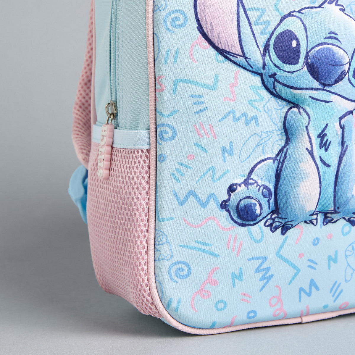 Stitch print backpack with adjustable shoulder straps and zip closure
