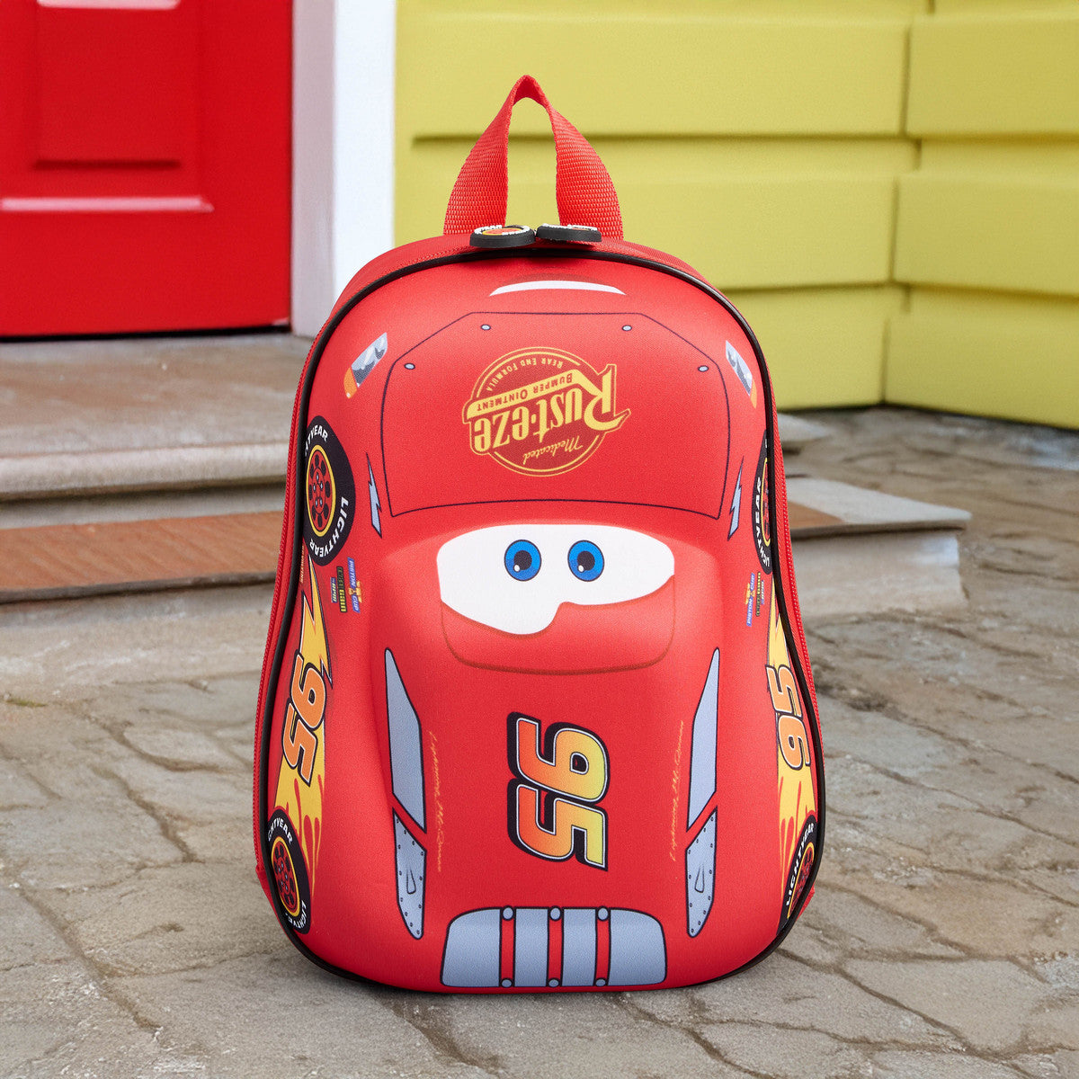 Car print backpack with adjustable shoulder straps and zip closure