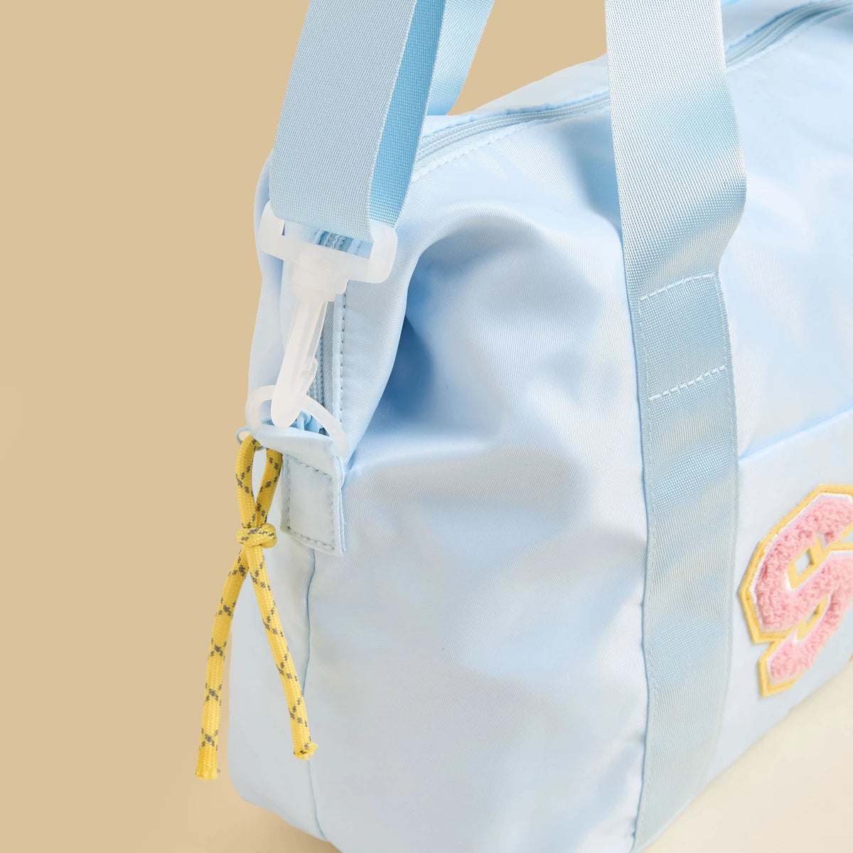 Stitch print duffle bag with zip closure