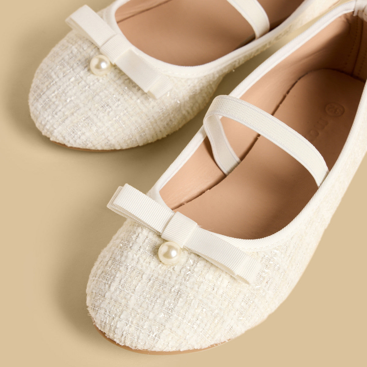 Pearl embellished ballerina shoes