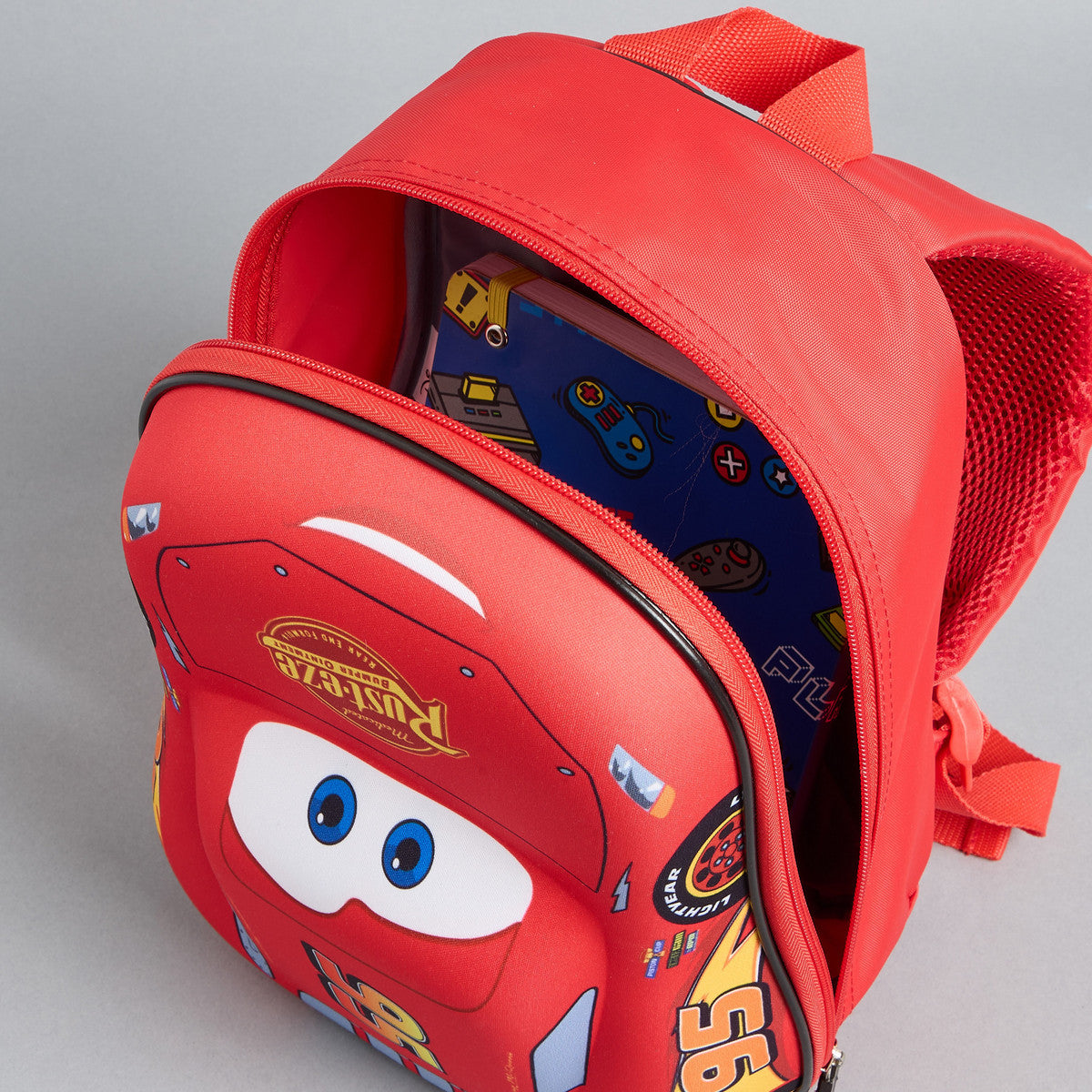 Car print backpack with adjustable shoulder straps and zip closure